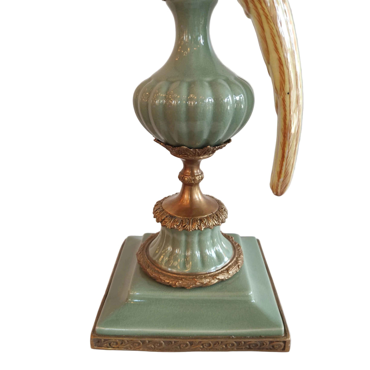 A pair of a colourful porcelain parrot candle holders with gilt bronze detailing. Crafted to exceptional quality, they add luxurious warmth and timeless charm to refined interiors