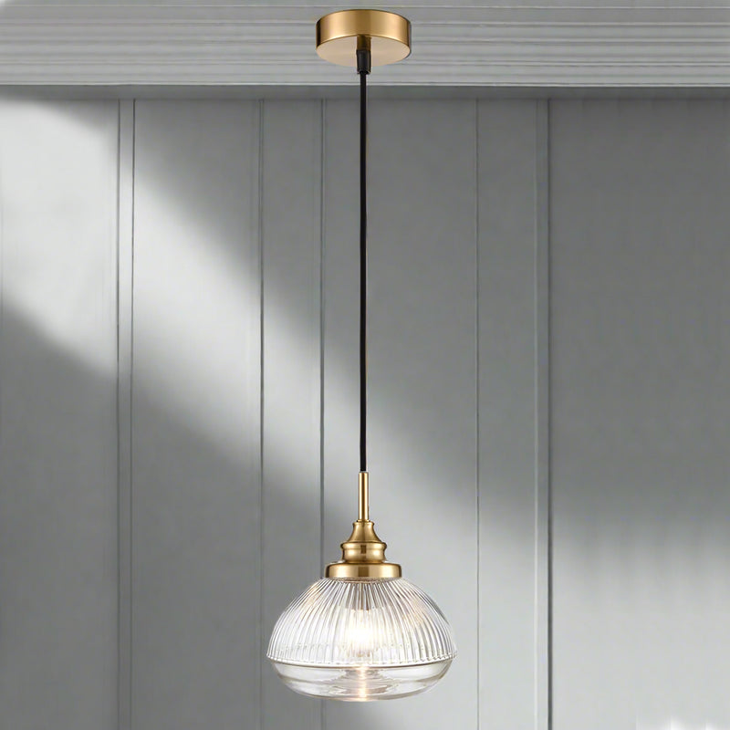 A ribbed glass pendant on beautifully designed brushed brass fittings. Perfect hallways, living room or kitchen light.