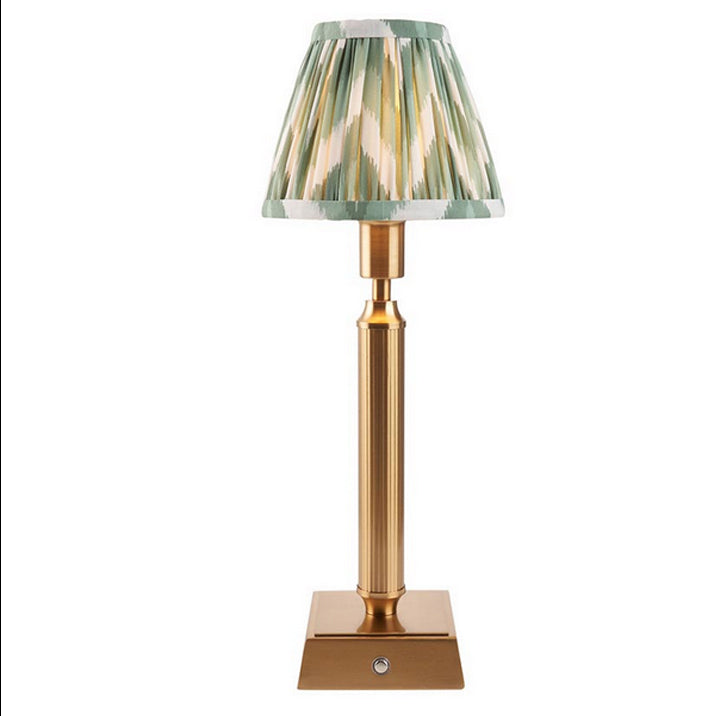 Brushed gold, rechargeable table lamp with a USB port.&nbsp; This portable, rechargeable 3 stage touch dimmer table lamp allows you to set your desired level of light.
They include a USB cable and an integrated warm white LED bulb.
These lamps are so convenient, can be placed wherever needed, no wires or plugs. Perfect for dining tables, desks or bedrooms. Can even be used outdoors making this a totally versatile lighting solution for your home.
Combine them with a beautiful pleated clip shade in three diff