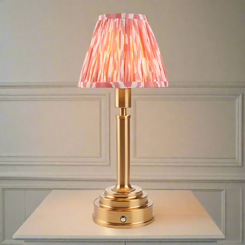 Brushed gold, rechargeable table lamp with a USB port. This portable, rechargeable 3 stage touch dimmer table lamp
