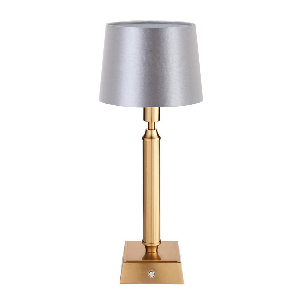 Brushed gold, rechargeable table lamp with a USB port. This portable, rechargeable 3 stage touch dimmer table lamp allows you to set your desired level of light. 