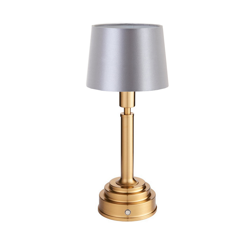 Brushed gold, rechargeable table lamp with a USB port. This portable, rechargeable 3 stage touch dimmer table lamp