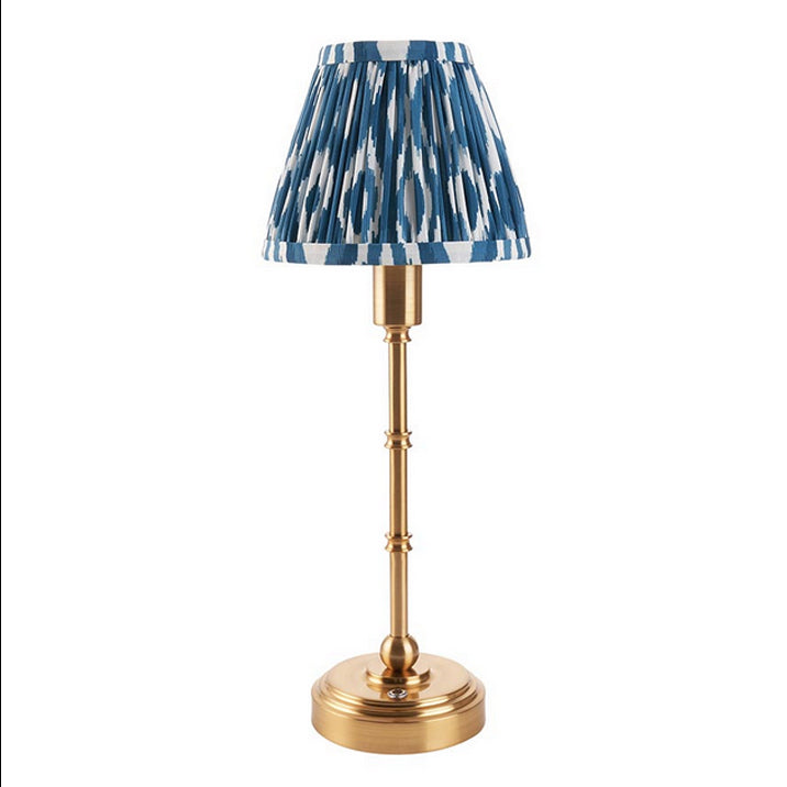Brushed gold, rechargeable table lamp with a USB port.&nbsp; This portable, rechargeable 3 stage touch dimmer table lamp allows you to set your desired level of light.
They include a USB cable and an integrated warm white LED bulb.
These lamps are so convenient, can be placed wherever needed, no wires or plugs. Perfect for dining tables, desks or bedrooms. Can even be used outdoors making this a totally versatile lighting solution for your home.
Combine them with a beautiful pleated clip shade in four diffe