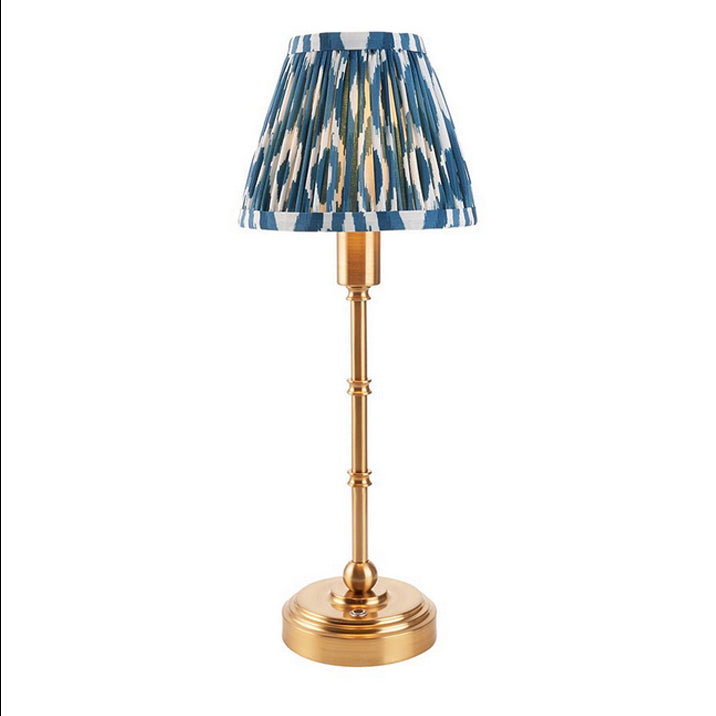 Brushed gold, rechargeable table lamp with a USB port.&nbsp; This portable, rechargeable 3 stage touch dimmer table lamp allows you to set your desired level of light.
They include a USB cable and an integrated warm white LED bulb.
These lamps are so convenient, can be placed wherever needed, no wires or plugs. Perfect for dining tables, desks or bedrooms. Can even be used outdoors making this a totally versatile lighting solution for your home.
Combine them with a beautiful pleated clip shade in four diffe