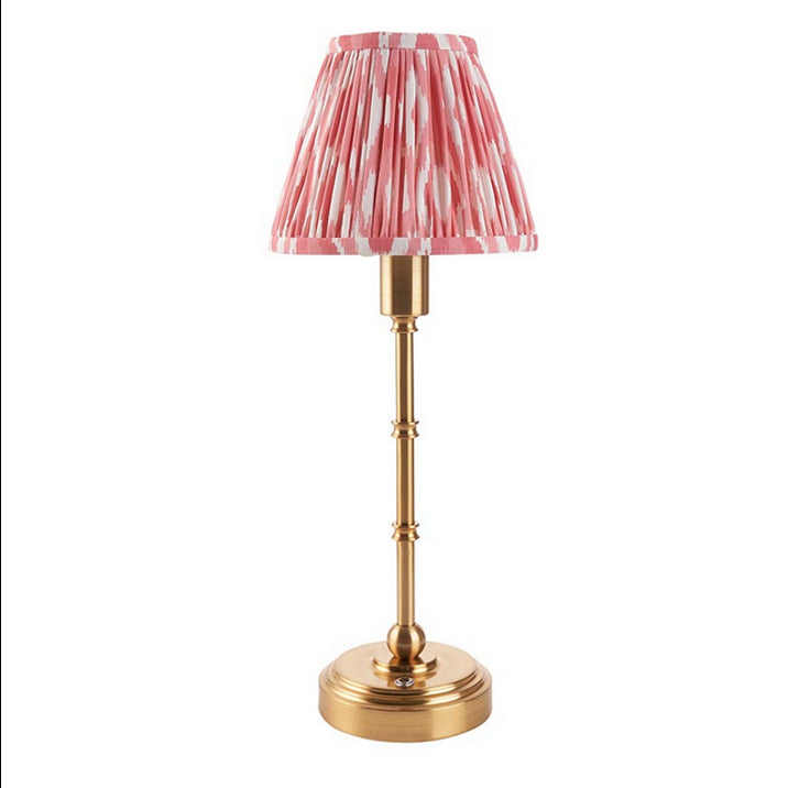 Brushed gold, rechargeable table lamp with a USB port.&nbsp; This portable, rechargeable 3 stage touch dimmer table lamp allows you to set your desired level of light.
They include a USB cable and an integrated warm white LED bulb.
These lamps are so convenient, can be placed wherever needed, no wires or plugs. Perfect for dining tables, desks or bedrooms. Can even be used outdoors making this a totally versatile lighting solution for your home.
Combine them with a beautiful pleated clip shade in four diffe