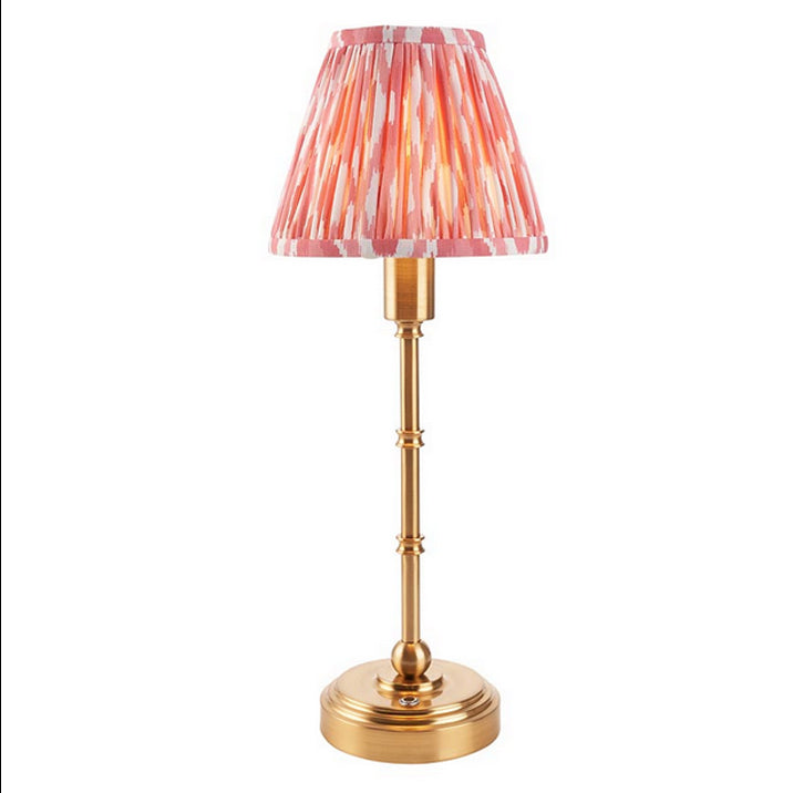 Brushed gold, rechargeable table lamp with a USB port.&nbsp; This portable, rechargeable 3 stage touch dimmer table lamp allows you to set your desired level of light.
They include a USB cable and an integrated warm white LED bulb.
These lamps are so convenient, can be placed wherever needed, no wires or plugs. Perfect for dining tables, desks or bedrooms. Can even be used outdoors making this a totally versatile lighting solution for your home.
Combine them with a beautiful pleated clip shade in four diffe