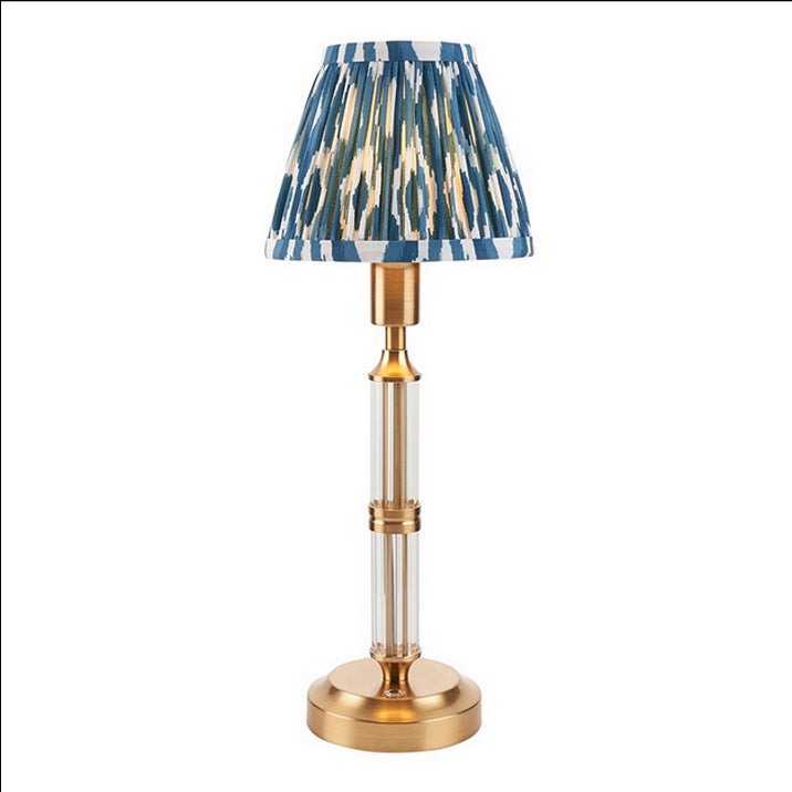 Brushed gold, rechargeable table lamp with a USB port.&nbsp; This portable, rechargeable 3 stage touch dimmer table lamp allows you to set your desired level of light.
They include a USB cable and an integrated warm white LED bulb.
These lamps are so convenient, can be placed wherever needed, no wires or plugs. Perfect for dining tables, desks or bedrooms. Can even be used outdoors making this a totally versatile lighting solution for your home.
Combine them with a beautiful pleated clip shade in four diffe