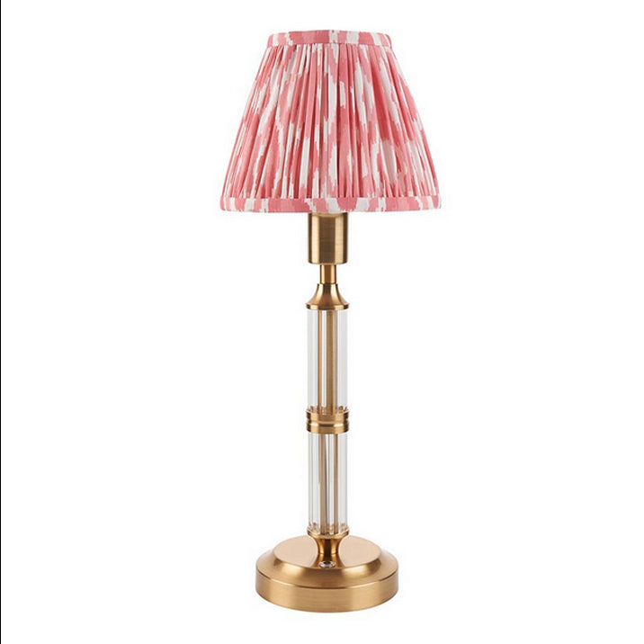 Brushed gold, rechargeable table lamp with a USB port.&nbsp; This portable, rechargeable 3 stage touch dimmer table lamp allows you to set your desired level of light.
They include a USB cable and an integrated warm white LED bulb.
These lamps are so convenient, can be placed wherever needed, no wires or plugs. Perfect for dining tables, desks or bedrooms. Can even be used outdoors making this a totally versatile lighting solution for your home.
Combine them with a beautiful pleated clip shade in four diffe