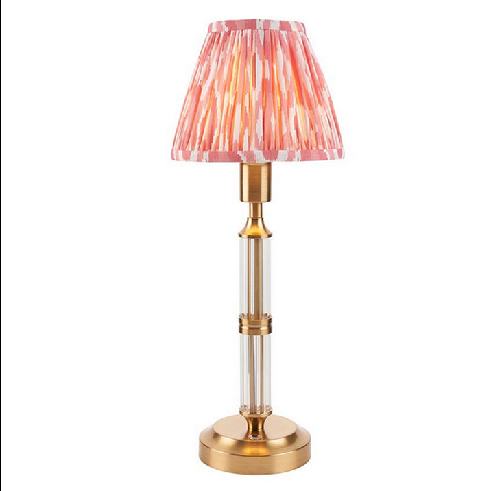Brushed gold, rechargeable table lamp with a USB port.&nbsp; This portable, rechargeable 3 stage touch dimmer table lamp allows you to set your desired level of light.
They include a USB cable and an integrated warm white LED bulb.
These lamps are so convenient, can be placed wherever needed, no wires or plugs. Perfect for dining tables, desks or bedrooms. Can even be used outdoors making this a totally versatile lighting solution for your home.
Combine them with a beautiful pleated clip shade in four diffe