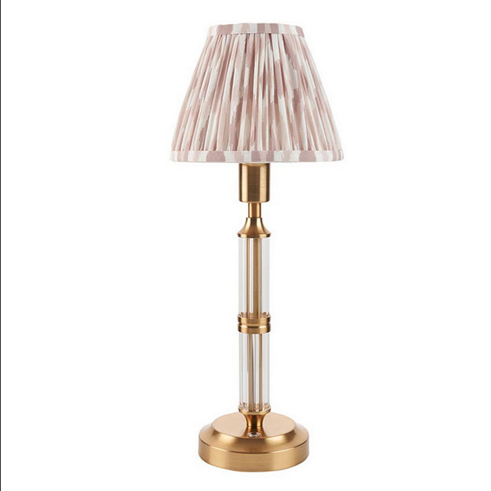 Brushed gold, rechargeable table lamp with a USB port.&nbsp; This portable, rechargeable 3 stage touch dimmer table lamp allows you to set your desired level of light.
They include a USB cable and an integrated warm white LED bulb.
These lamps are so convenient, can be placed wherever needed, no wires or plugs. Perfect for dining tables, desks or bedrooms. Can even be used outdoors making this a totally versatile lighting solution for your home.
Combine them with a beautiful pleated clip shade in four diffe