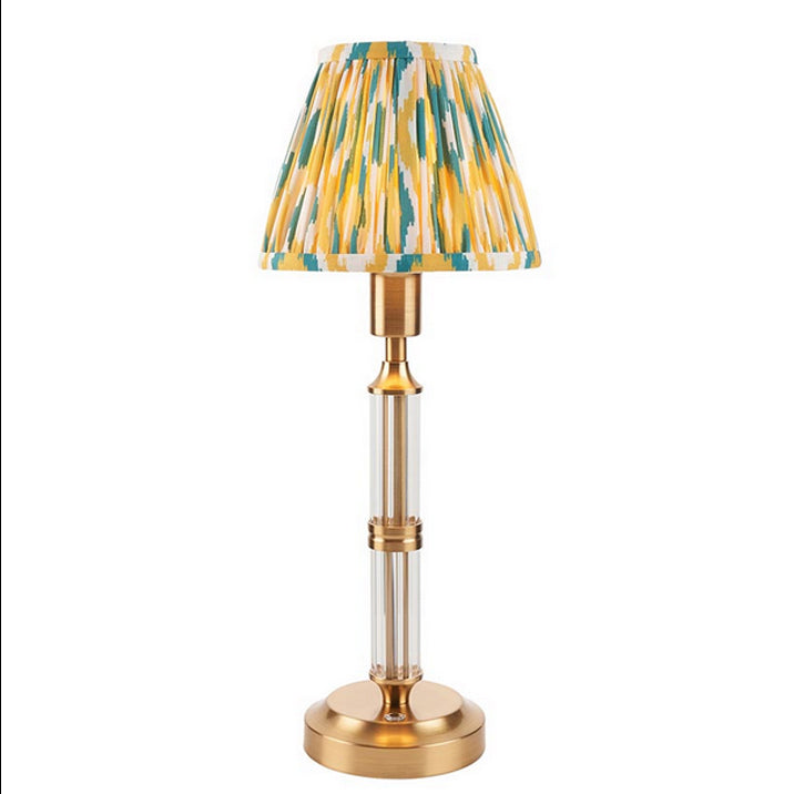 Brushed gold, rechargeable table lamp with a USB port.&nbsp; This portable, rechargeable 3 stage touch dimmer table lamp allows you to set your desired level of light.
They include a USB cable and an integrated warm white LED bulb.
These lamps are so convenient, can be placed wherever needed, no wires or plugs. Perfect for dining tables, desks or bedrooms. Can even be used outdoors making this a totally versatile lighting solution for your home.
Combine them with a beautiful pleated clip shade in four diffe