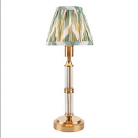 Brushed gold, rechargeable table lamp with a USB port.&nbsp; This portable, rechargeable 3 stage touch dimmer table lamp allows you to set your desired level of light.
They include a USB cable and an integrated warm white LED bulb.
These lamps are so convenient, can be placed wherever needed, no wires or plugs. Perfect for dining tables, desks or bedrooms. Can even be used outdoors making this a totally versatile lighting solution for your home.
Combine them with a beautiful pleated clip shade in three diff