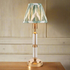 Brushed gold, rechargeable table lamp with a USB port.&nbsp; This portable, rechargeable 3 stage touch dimmer table lamp allows you to set your desired level of light.
They include a USB cable and an integrated warm white LED bulb.
These lamps are so convenient, can be placed wherever needed, no wires or plugs. Perfect for dining tables, desks or bedrooms. Can even be used outdoors making this a totally versatile lighting solution for your home.
Combine them with a beautiful pleated clip shade in three diff