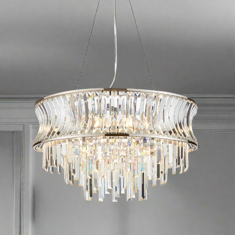 A beautiful nickel plated crystal chandelier. The light consists of a crystal band with a cascading drop of crystal prisms. An unusual large shaped chandelier, a really pretty fitting perfect for a living room or large hall,