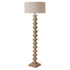 A really interesting notched, carved wooden floor lamp base, perfectly matched with a round linen shade of similar colour. Perfect neutral colour to blend in any interior. 