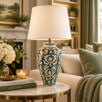 green & white ceramic table lamp in a living room