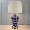 Blue and white ceramic lamp base on a gilt metal base with a neutral coloured linen style shade. The blue and white urn shaped ceramic lamp is a staple of any country house, and looks just as good in a period city home.


H: 66 cm W: 36 cm 