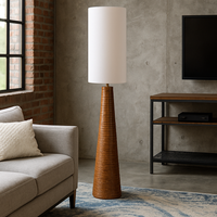 Tall, caramel coloured ribbed ceramic floor lamp in a cone shape with a matching tall funnel shaped shade in a linen colour. Definitely for the contemporary or mid-century style home. Exceptionally stylish shade and the base has a slightly rustic edge to the toffee coloured ceramic base.&nbsp; Beautifully finished a real statment light to add interest to your living room, hall, dining room anywhere you want to add light.