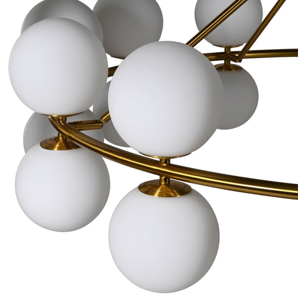 Massive, opaque globe chandelier, 24 globes set around a brushed gold frame, an absolute statement in any room.