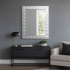This is a Venetian-style wall mirror featuring a striking raised decorative frame. The rectangular mirror is bordered by a geometric design of square mirrored tiles, each accented with a raised circular dome detail that adds dimension, texture, and light-catching elegance. The reflective frame enhances the mirror’s brilliance, making it not only functional but also a bold decorative statement.

Its clean lines and sculptural frame give it a contemporary twist on classic Venetian design, making it versatile 