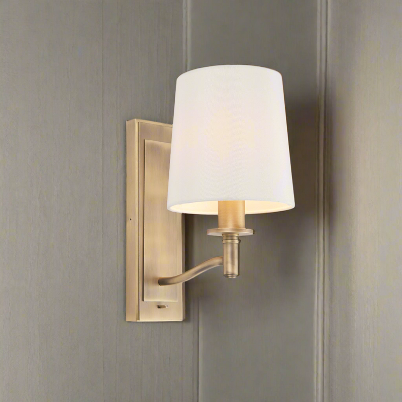 White shaded gilt wall light with integral switch, perfect bedside wall lights. Great in a living room or dining room.