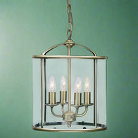 Traditionally shaped lantern in an antiqued brass finish with 4 lights, perfect country house on town house hall light.
