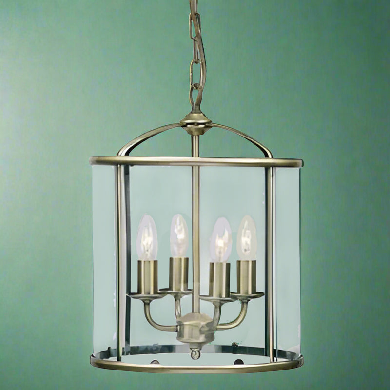 Traditionally shaped lantern in an antiqued brass finish with 4 lights, perfect country house on town house hall light.