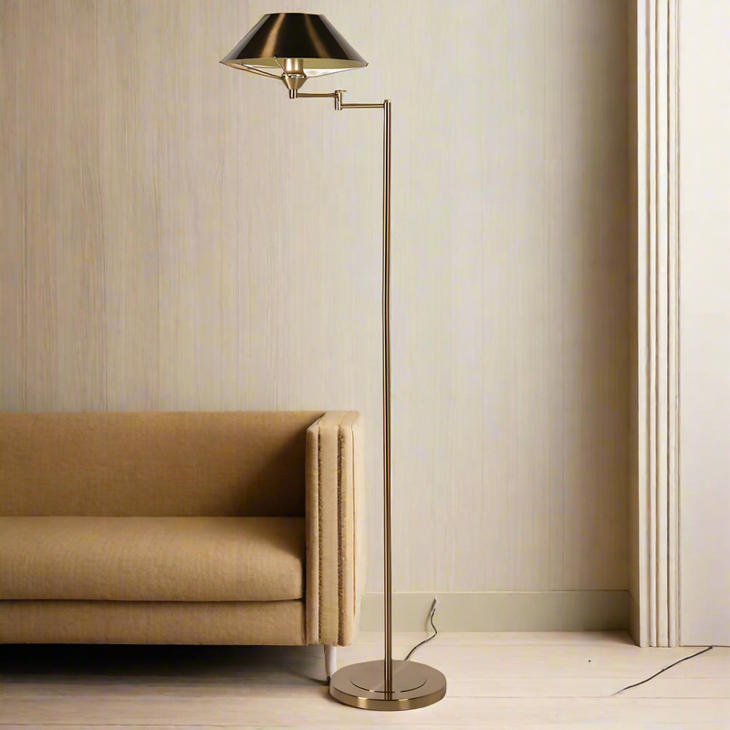 A tall classic dark brass floor lamp with extendable arm to the shade.&nbsp; Based on an antique lamp, this light would work well over a reading chair in your living room or in a library or study. The dark bronze/brass finish works well in a period home interior.&nbsp; The extendable, swing arm on the shade allows the light to fall wherever directed.