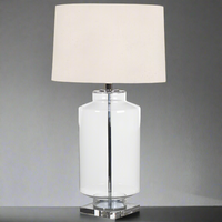 A large clear glass statement lamp on marble base plinth.&nbsp; This is a striking piece which will emit a lovely light as a side or corner table lighting, or on a very large console or hall table. 