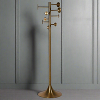 Tall aged brass coat stand with 8 hooks, featuring a sleek and glamorous design. Perfect for home decor, combining style and practicality.