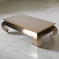 An extraordinary metal coffee table, the ultimate in glamorous furniture. Large enough to make a real statement in a room. This extra large gilt metal table is 140 cm wide and 80 cm deep so will make an enormous impact.&nbsp; &nbsp;Sleek, gilt metallic with exquisite , bold curved legs.&nbsp; It is Asian inspired modern glamour, an absolute stand out piece that would need to be in an ultra stylish area.&nbsp; It is almost a sculptural work of art but it is definitely also functional and needs to be used.&nb