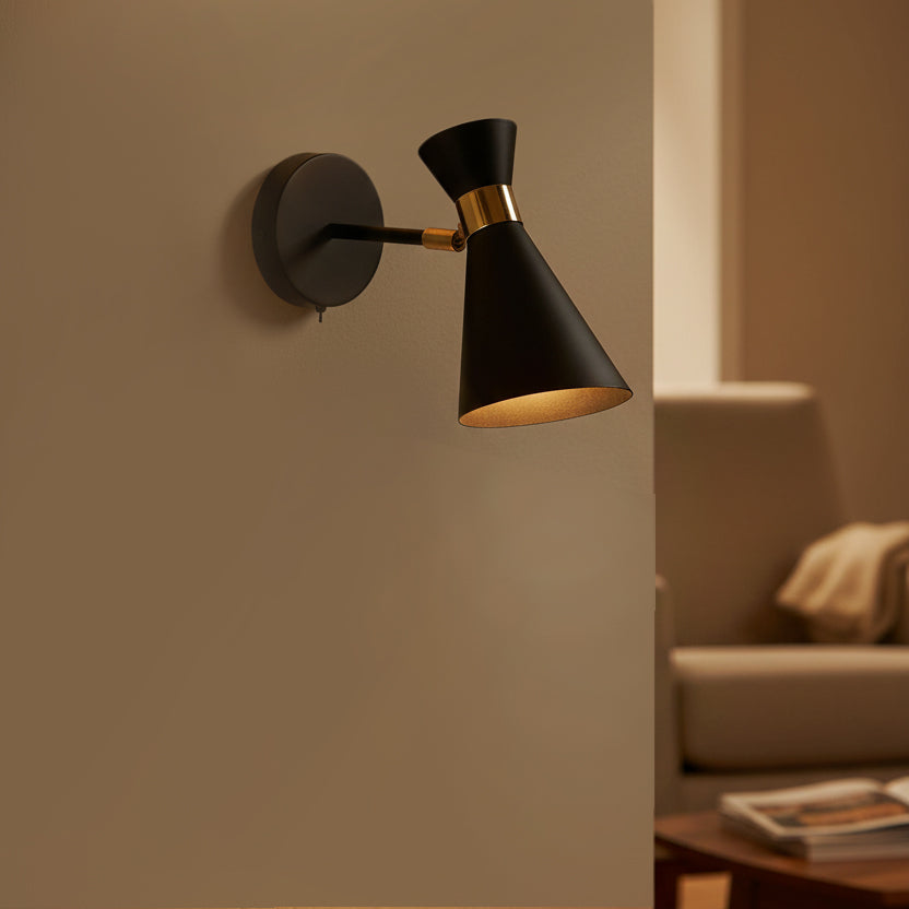 black and brass wall light in a living room
