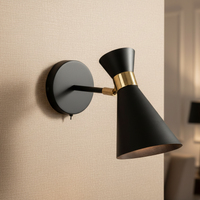 black and brass wall light in a living room