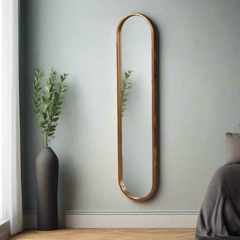 Tall, slim oval metal framed mirror with copper tinges. Perfect dressing room mirror, great at the end of narrow hall. This mirror is the perfect height for a dark narrow corner,