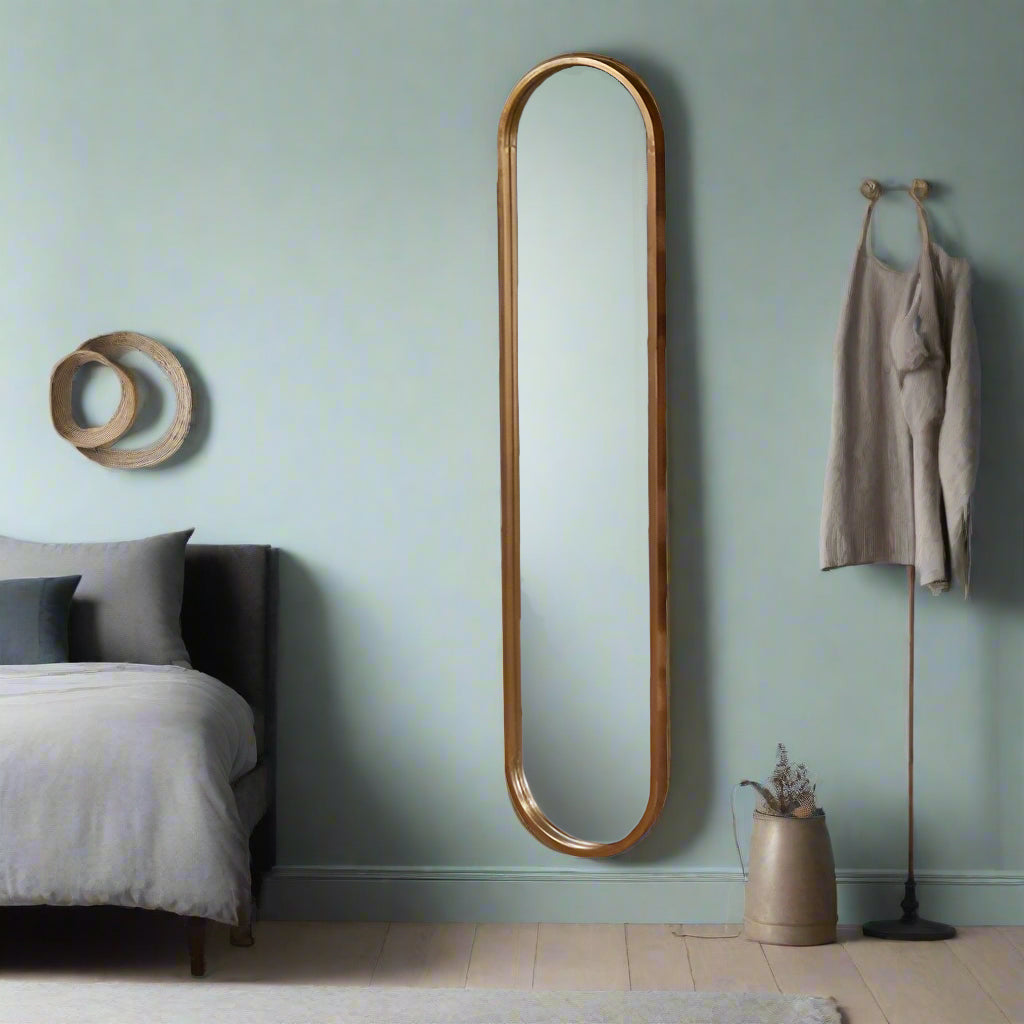 Tall, slim oval metal framed mirror with copper tinges. Perfect dressing room mirror, great at the end of narrow hall. This mirror is the perfect height for a dark narrow corner,