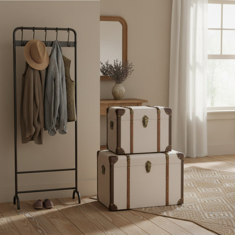 A pair of vintage-style storage trunks in a hallway