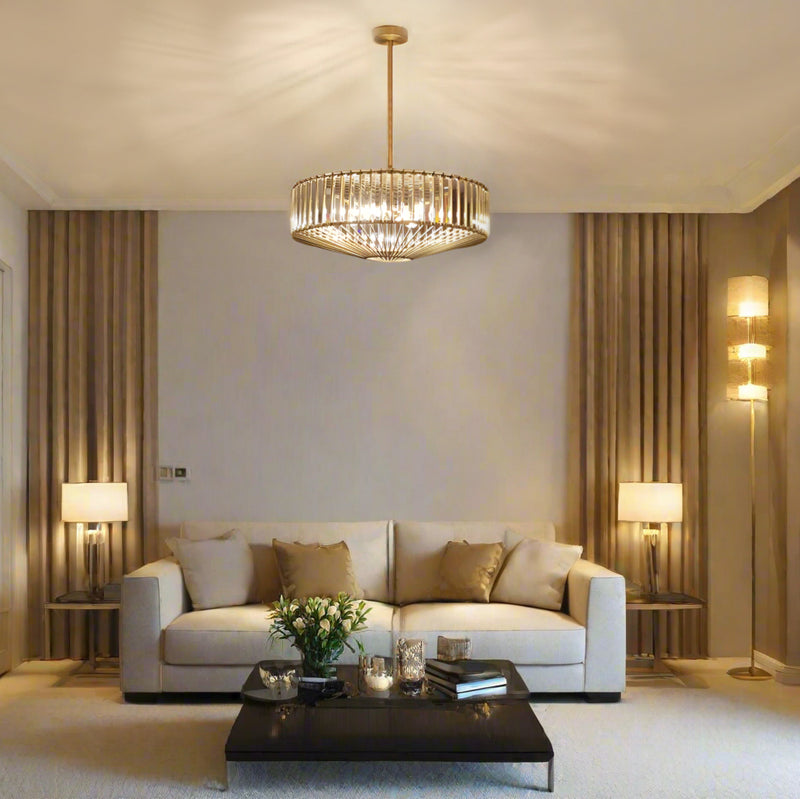 An elegant crystal and bronze chandelier with adjustable height. Its warm glow and geometric design elevate dining rooms, living rooms or hallways