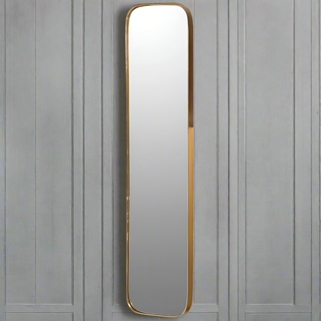 Gold Gilt Slimline Curved Edge Mirror. Although narrow, this mirror works well as a full length mirror when hung on a bedroom or dressing room mirror. Perfect for a narrow space, but long enough to have a great impact.