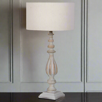 A really decorative heavily turned wooden lamp base, a really elegant shape. Topped with a neutral linen shade, this would be a perfect bedside lamp but would look just as splendid in a living room or hall atop a classic console table.
