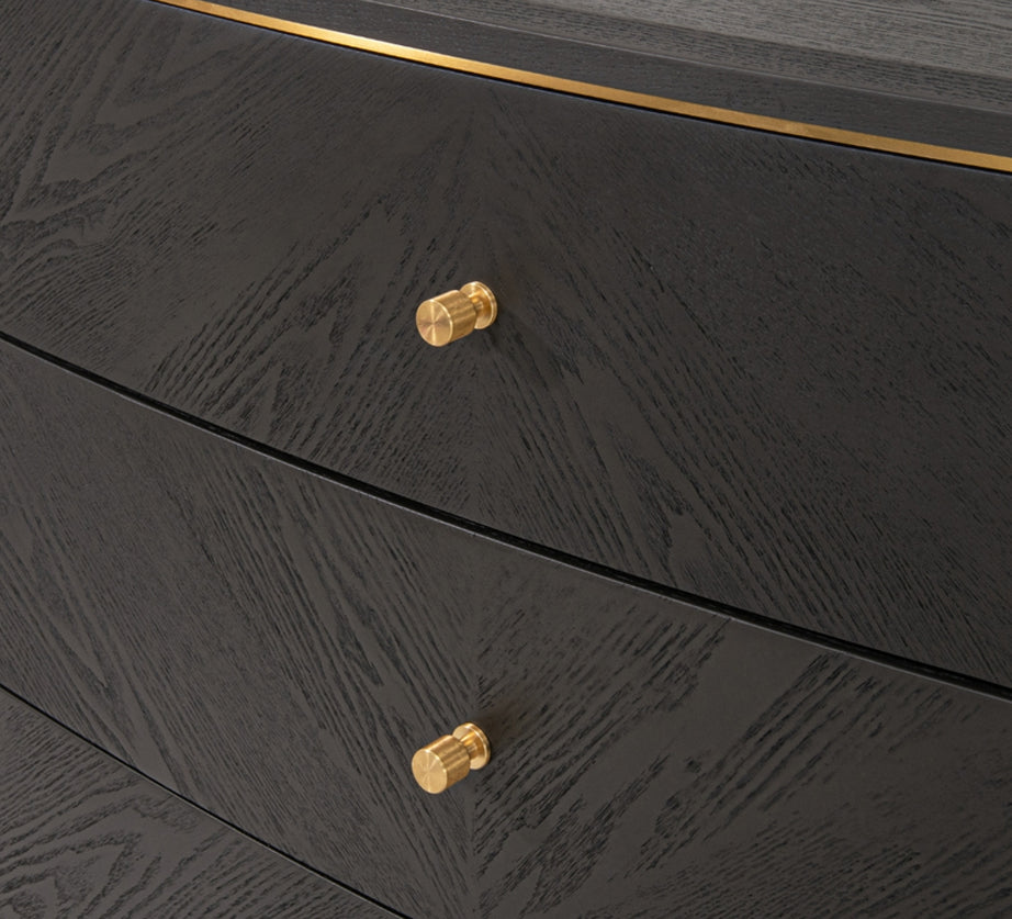 This stylish chest of drawers features a dark grey finish with great wood texture for a unique look. It is complemented by elegant brass handles and brushed gold feet.

It has three deep drawers with plenty of storage. The classic design pairs beautifully with modern and traditional decor, making it perfect for any interior design style adding a touch of luxury to any room.