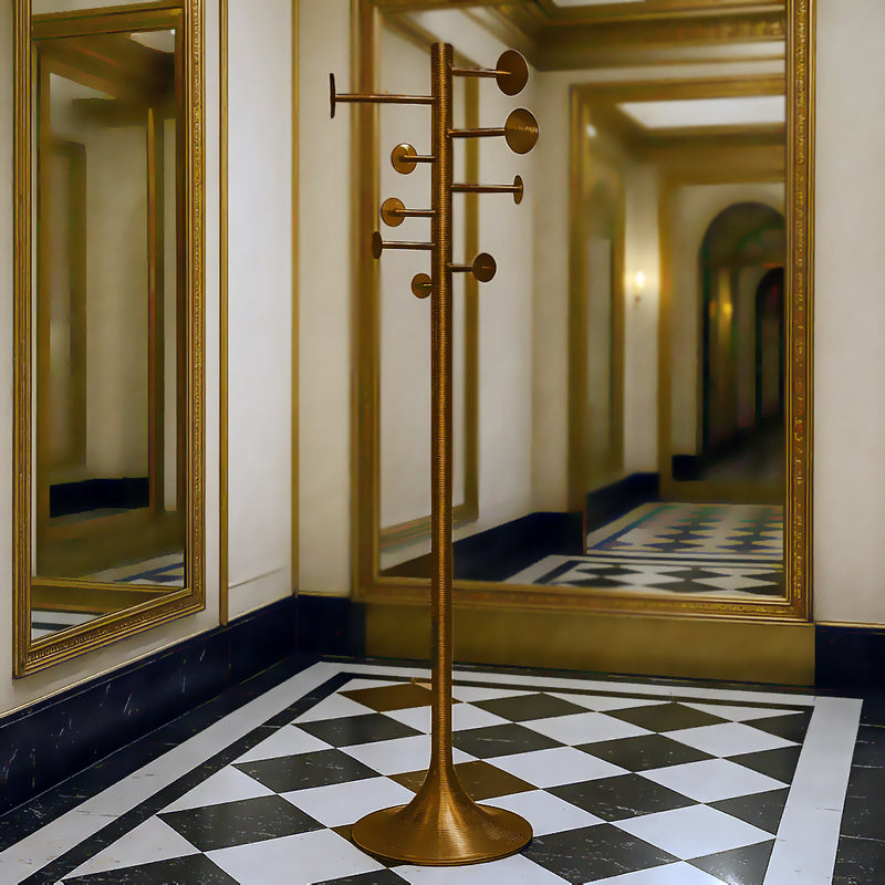 Modern aged brass coat rack with geometric design in a contemporary hallway setting