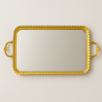 gilt tray with mirrored top and two decorative handles, great in a bedroom for jewellery or as a festive serving tray.