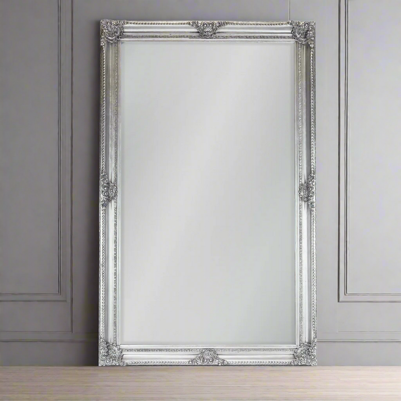 Oversize silver ornate carved mirror with a swept frame, exceptional size to give an enormous amount of reflected light into a room. This 'Louis' style of mirror adds an air of grandeur to any room, the silver colour also looks amazing in a contemporary setting, in a hallway, bedroom or any living space.