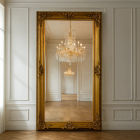 Extra  large classic ornate  mirror  In a hallway, leant against a wall in a period house