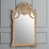 An oversized ornate mirror in a weathered, limewashed finish. A great reproduction of an antique mirror, adding real grandeur and interest to your wall.&nbsp; Carved, ornate mirrors are perfect in your hall or sitting room, adding space and light.