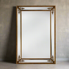 Extra large gold panelled mirror with corner motifs, stunning effect, highly reflective.&nbsp; Grand mirror, perfect in any room.&nbsp; This is the perfect mirror for a darker space, will allow you maximum reflective light, the gilt motifs at each corner highlight the beveled panels making this a really decorative mirror, for your hall, bedroom or any living space.