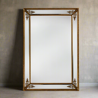 Extra large gold panelled mirror with corner motifs, stunning effect, highly reflective.&nbsp; Grand mirror, perfect in any room.&nbsp; This is the perfect mirror for a darker space, will allow you maximum reflective light, the gilt motifs at each corner highlight the beveled panels making this a really decorative mirror, for your hall, bedroom or any living space.