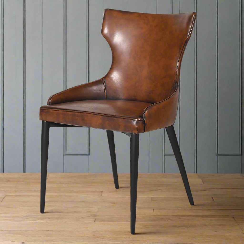 Faux leather dining chair with a high backrest in warm chestnut color, sleek black wooden legs, perfect for dining or study areas.