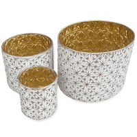 White and gold festive metal containers for holiday decor