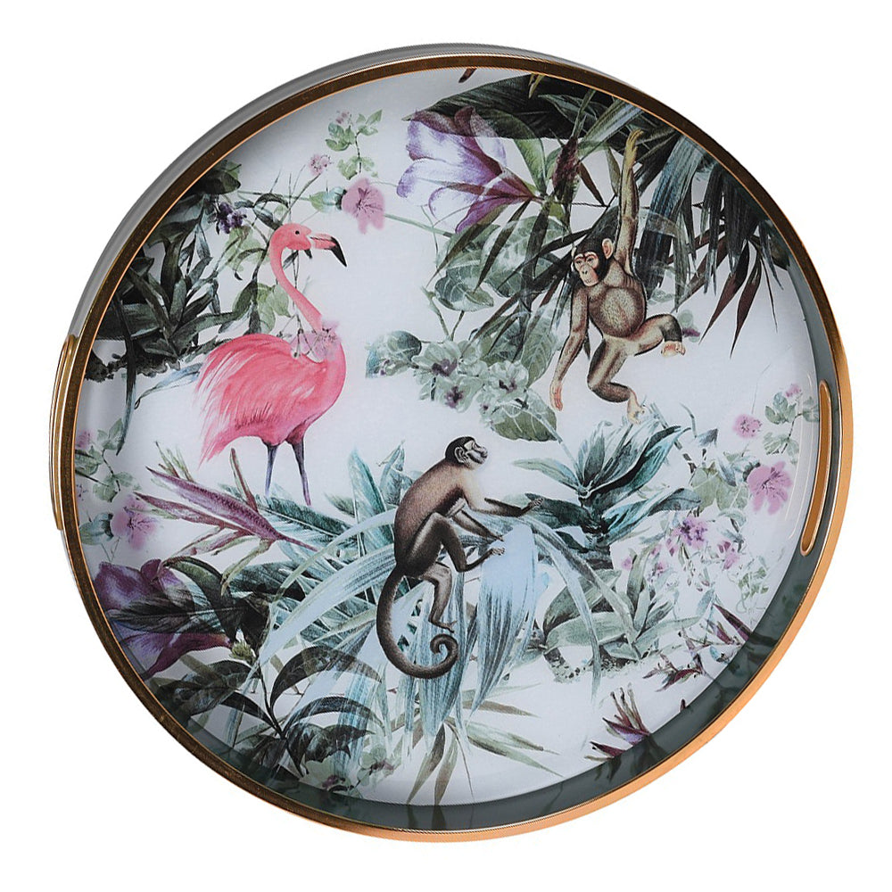 Gorgeous, round tray with a gilt rim. A luxurious look and ideal home gift.
Bring a touch of the exotic to your home with this vibrant Tropical Flamingo &amp; Monkey Tray. Measuring 40cm in diameter, this round tray features a stunning jungle-inspired design with a playful pink flamingo, monkeys, and lush botanical foliage in rich greens, purples, and soft pastels. Crafted with a high-gloss finish and bordered with a sleek gold rim, it’s as practical as it is eye-catching. Ideal for serving drinks, displayi